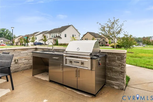 a view of a kitchen with outdoor kitchen and stove