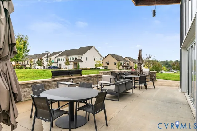 a view of an chairs and tables in the patio