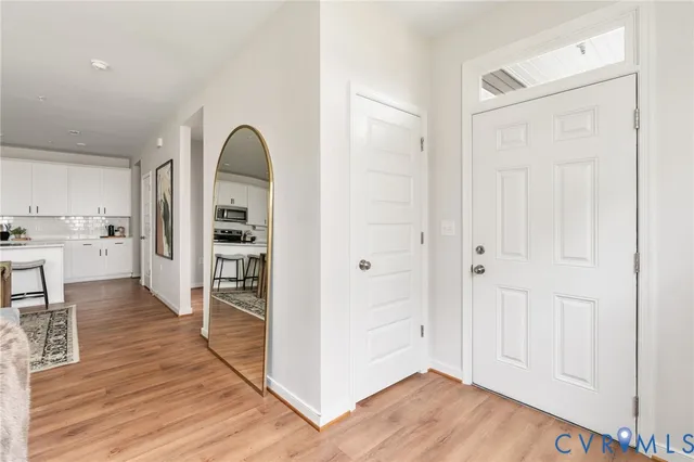 a view of kitchen with furniture and wooden floor