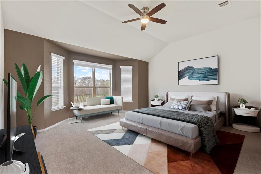 11306 Runnel Ridge Road Manor, TX 78653 - Photo 14 of 26 a bedroom with a large bed couch and a large window