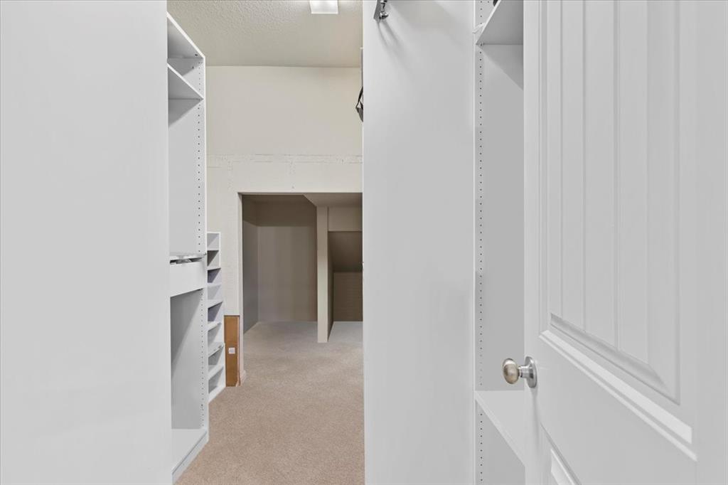 11306 Runnel Ridge Road Manor, TX 78653 - Photo 18 of 26 a view of a room with a hallway