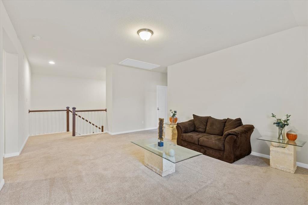 11306 Runnel Ridge Road Manor, TX 78653 - Photo 19 of 26 a living room with furniture and a couch