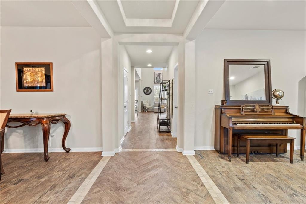 11306 Runnel Ridge Road Manor, TX 78653 - Photo 4 of 26 a view of a livingroom with furniture and staircase