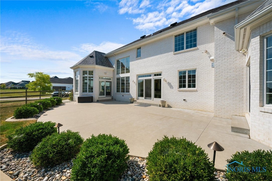 26006 Seminary Road Perrysburg, OH 43551 - Photo 35 of 40 Sculpted Patio that spans from Primary Suite to the Sunroom