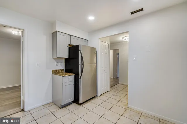 a utility room with cabinets washer and dryer