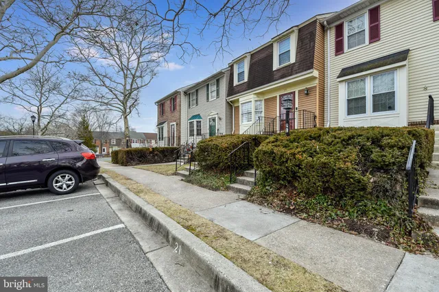 a view of a car parked on the side of a road