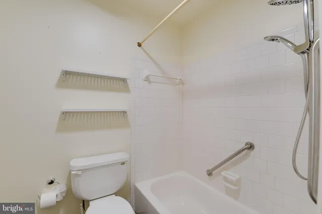 a bathroom with a toilet and a sink