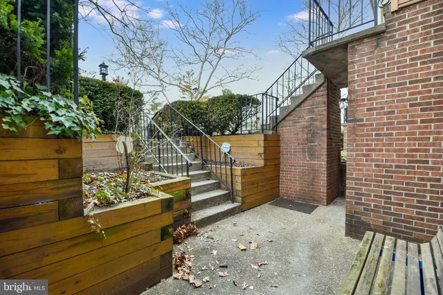 a view of balcony with wooden floor and fence