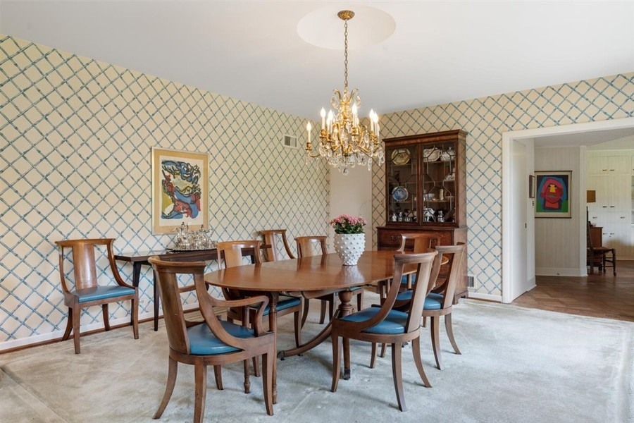 589 Greenleaf Avenue Glencoe, IL 60022 - Photo 13 of 40 a view of a dining room with furniture and chandelier