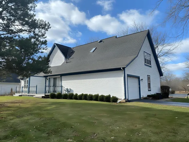 a view of a house with a big yard