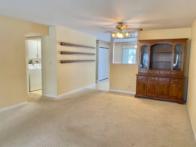a kitchen with cabinets and a stove