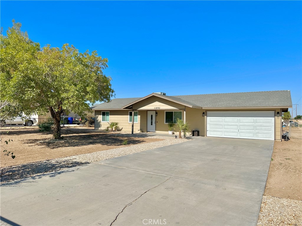 11892 Wapato Road Apple Valley, CA 92308 - Photo 1 of 1 a view of a house with a yard