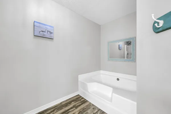 a bathroom with a glass shower door