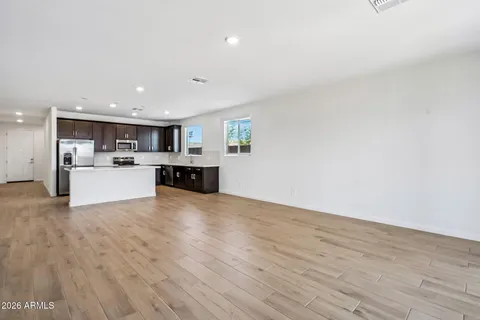 a view of kitchen with wooden floor