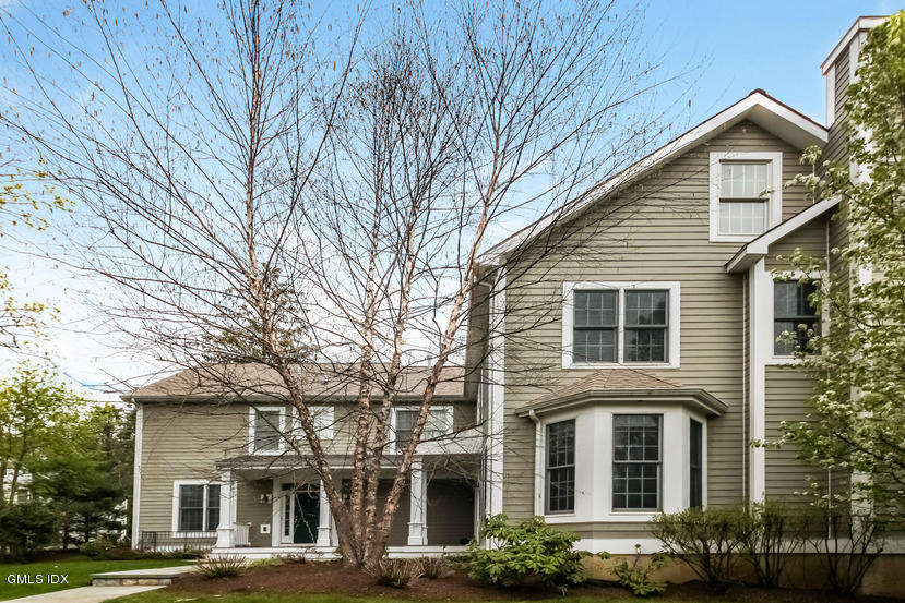 25 Decatur Street, Unit A Cos Cob, CT 06807 - Photo 1 of 29 a front view of a residential houses with yard