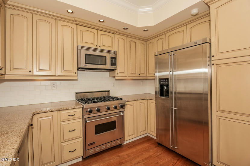 25 Decatur Street, Unit A Cos Cob, CT 06807 - Photo 13 of 29 a kitchen with stainless steel appliances granite countertop a refrigerator stove and sink