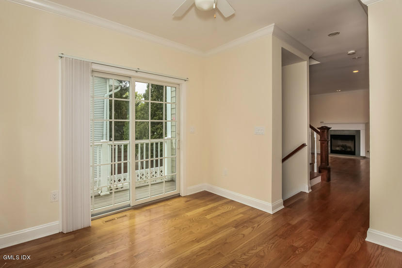 25 Decatur Street, Unit A Cos Cob, CT 06807 - Photo 15 of 29 wooden floor in an empty room with a window