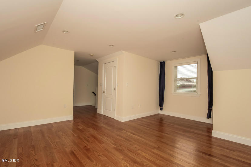 25 Decatur Street, Unit A Cos Cob, CT 06807 - Photo 23 of 29 a view of an empty room with wooden floor