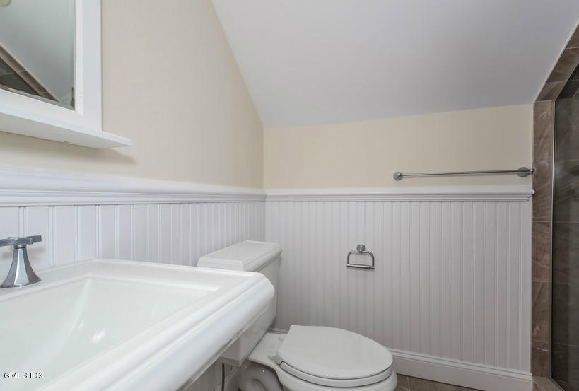 25 Decatur Street, Unit A Cos Cob, CT 06807 - Photo 25 of 29 a bathroom with a sink a toilet and shower