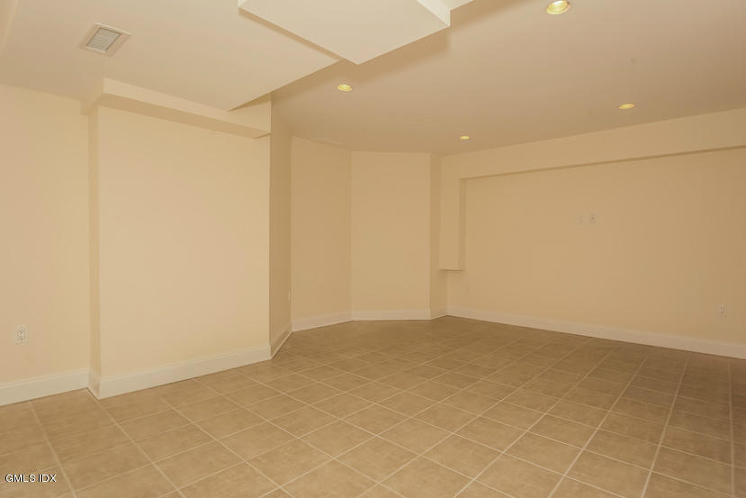 25 Decatur Street, Unit A Cos Cob, CT 06807 - Photo 27 of 29 an empty room with a empty space
