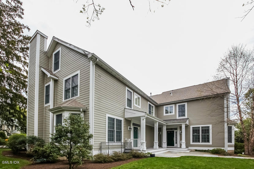 25 Decatur Street, Unit A Cos Cob, CT 06807 - Photo 6 of 29 a front view of a house with garden