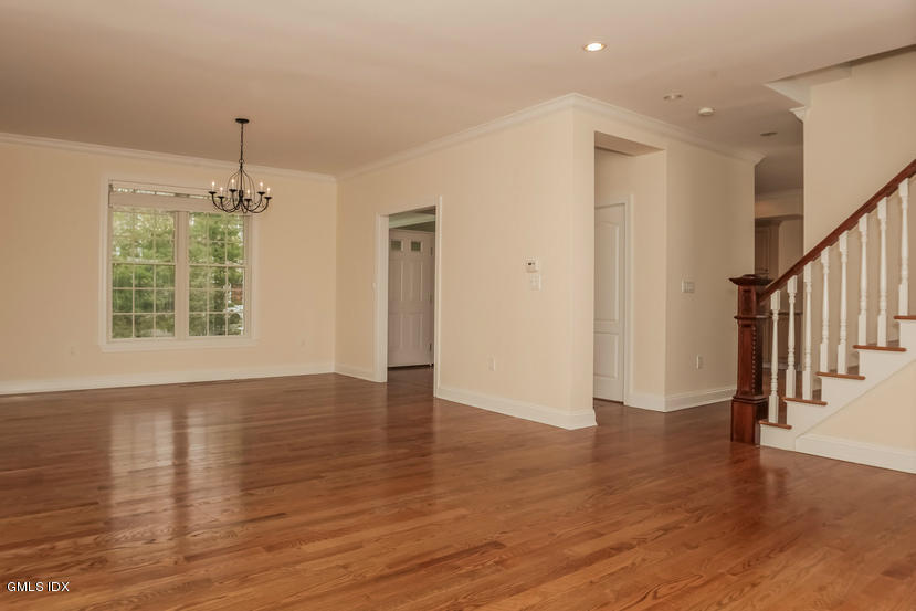 25 Decatur Street, Unit A Cos Cob, CT 06807 - Photo 8 of 29 wooden floor in an empty room with a window