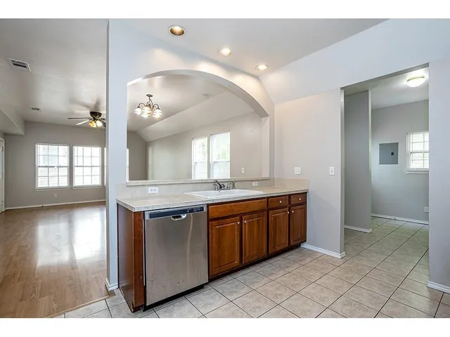 a large bathroom with a large tub and sink