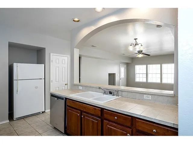 a bathroom with a sink double vanity and a mirror