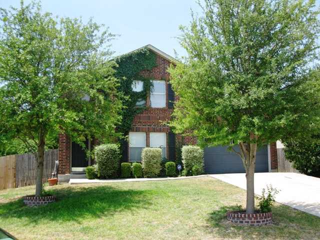 905 Springbrook Road Pflugerville, TX 78660 - Photo 1 of 1 a front view of a house with a yard and trees