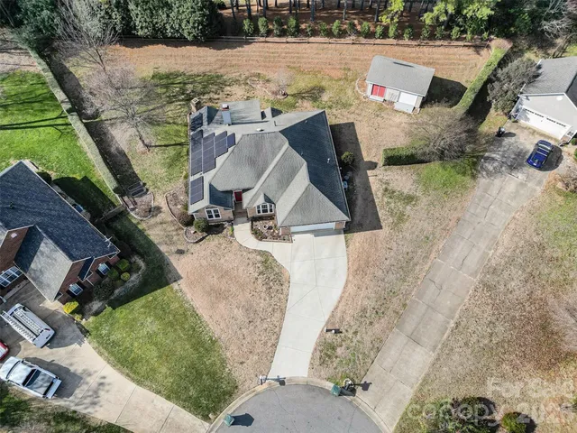 an aerial view of a house with outdoor space