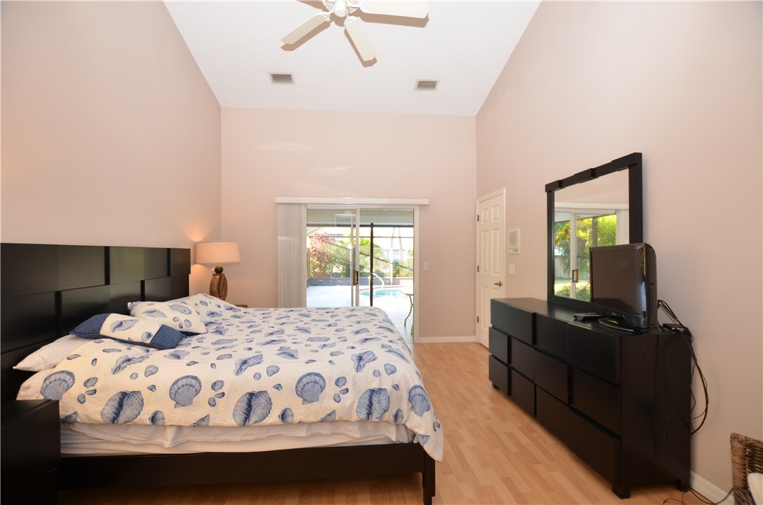 155 Midvale Terrace Sebastian, FL 32958 - Photo 11 of 16 a bedroom with a bed and dresser