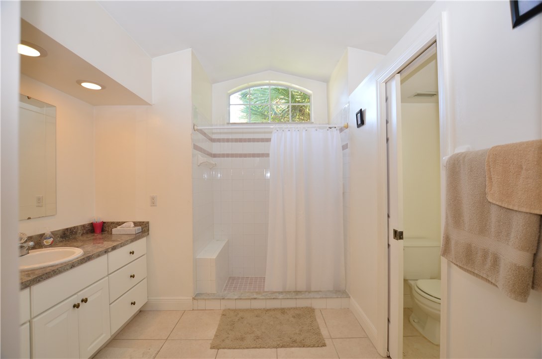 155 Midvale Terrace Sebastian, FL 32958 - Photo 12 of 16 a bathroom with a granite countertop sink and a mirror