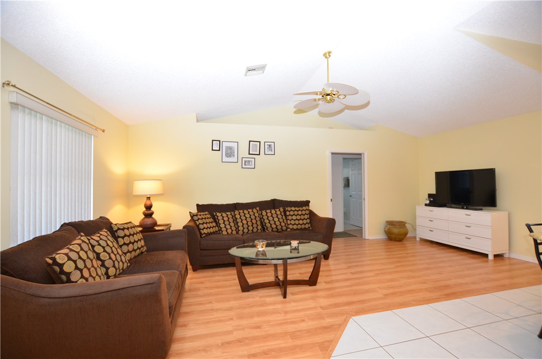 155 Midvale Terrace Sebastian, FL 32958 - Photo 7 of 16 a living room with furniture and a flat screen tv