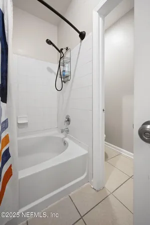 a en suite bathroom with a sink a mirror and a shower