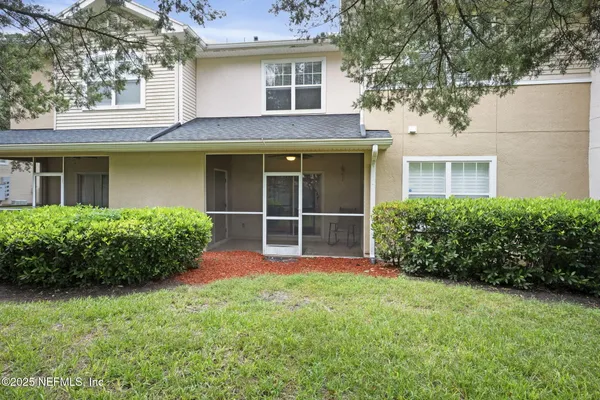 a house with tree in front of it