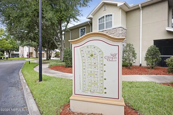 a view of a lake with a yard