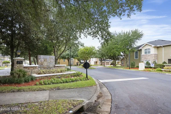 an aerial view of a house with a garden and swimming pool