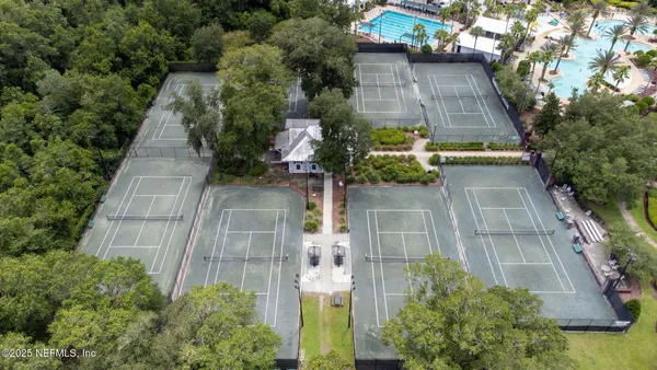 an aerial view of a swimming pool and outdoor space