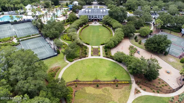 an aerial view of house with yard swimming pool and outdoor seating