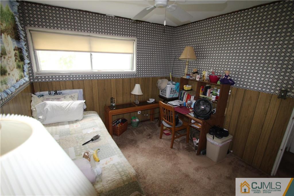 3 Vernon Road Edison, NJ 08817 - Photo 12 of 16 a view of a room with furniture and a window