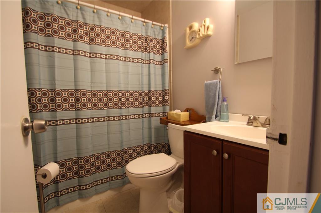 3 Vernon Road Edison, NJ 08817 - Photo 15 of 16 a bathroom with a sink toilet and shower