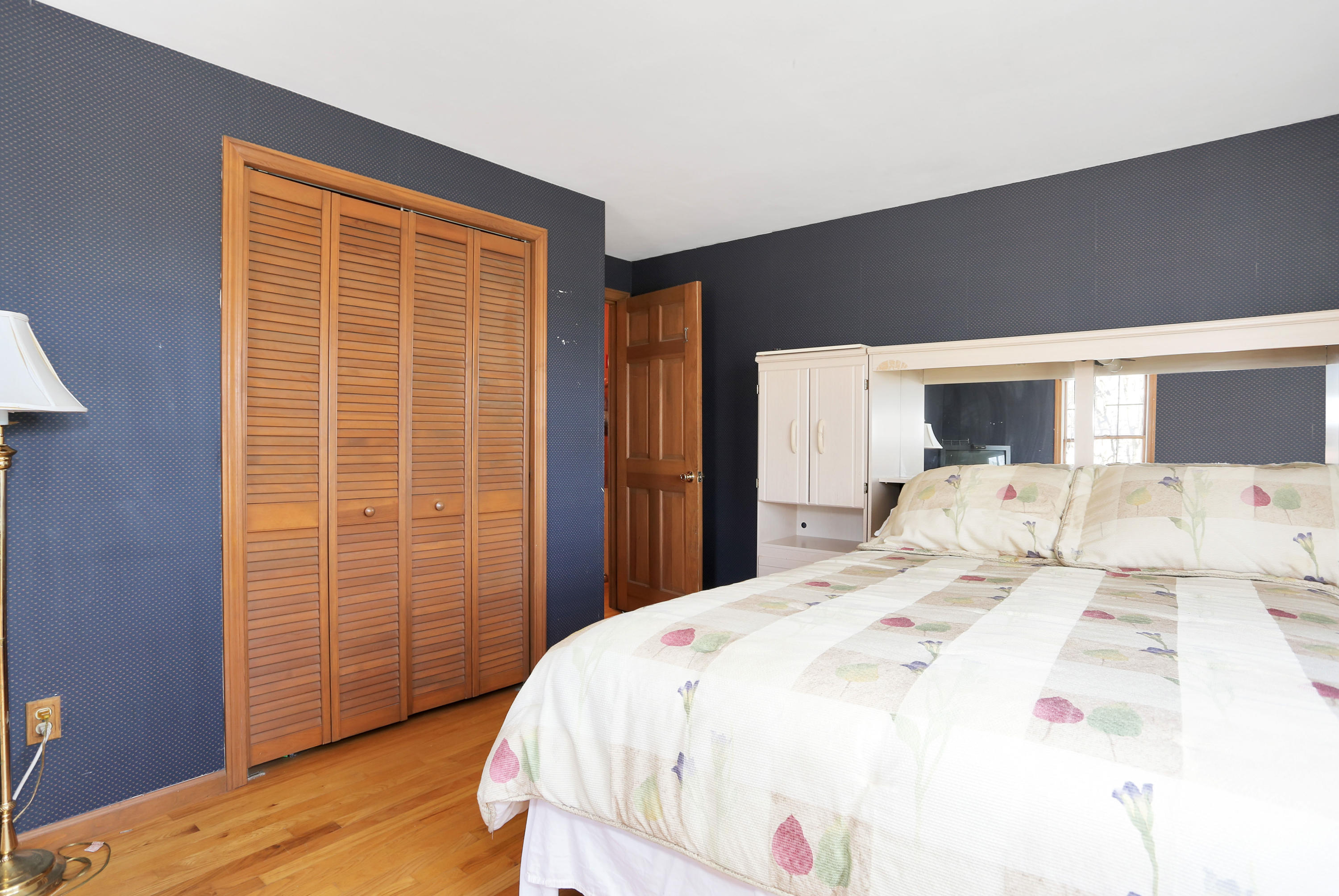 188 Camelback Road Marstons Mills, MA 02648 - Photo 11 of 22 a bed sitting in a bedroom next to a window