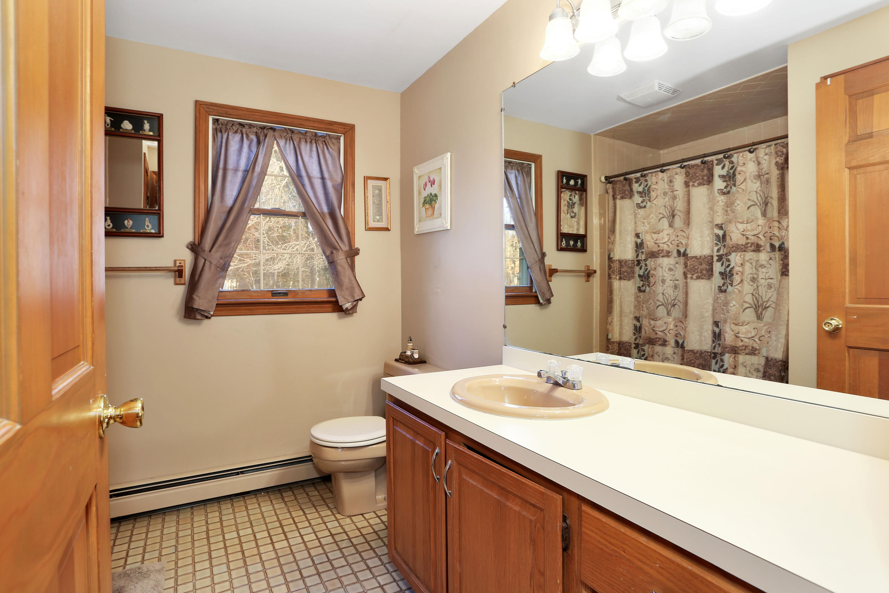 188 Camelback Road Marstons Mills, MA 02648 - Photo 12 of 22 a bathroom with a sink a toilet and shower