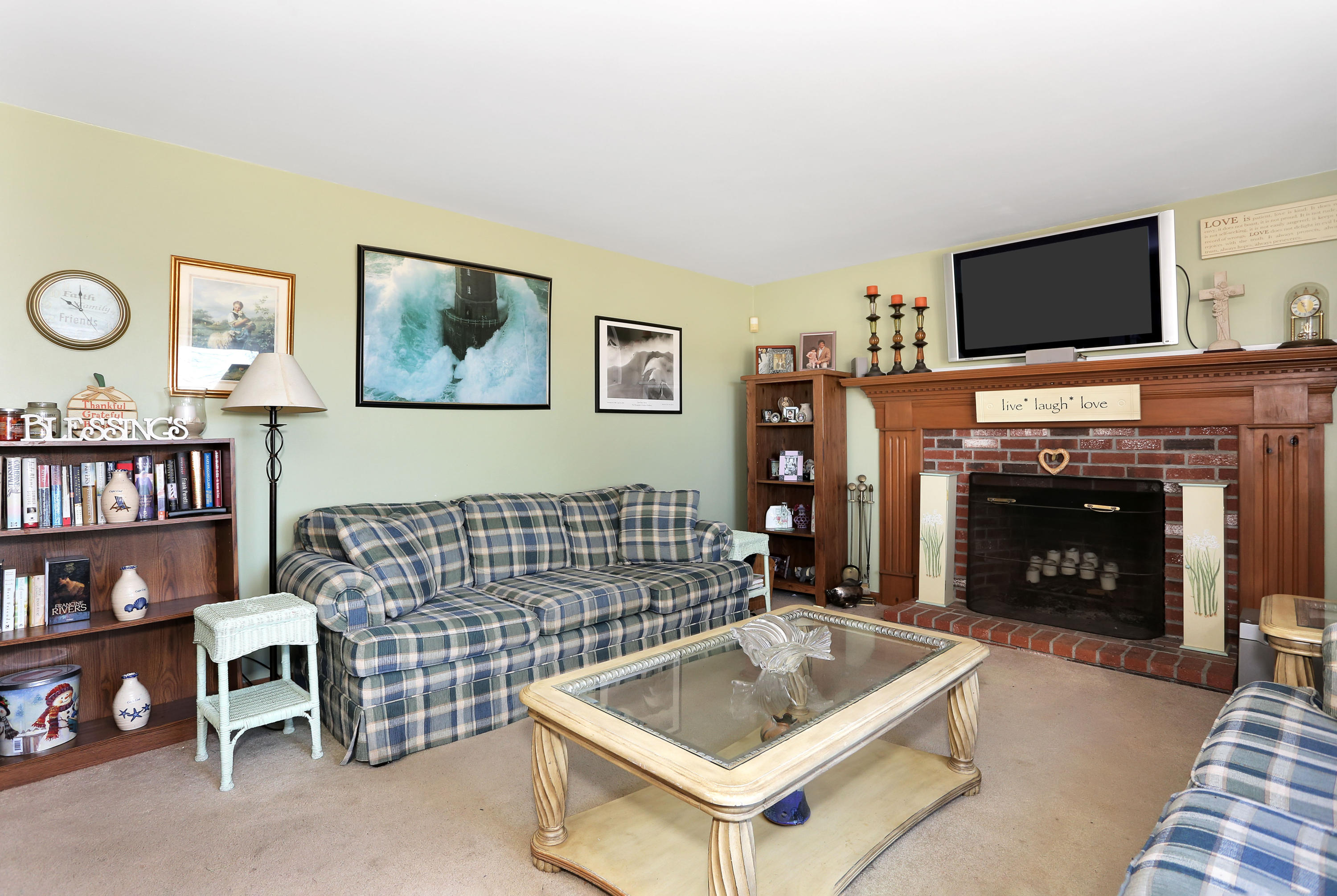 188 Camelback Road Marstons Mills, MA 02648 - Photo 4 of 22 a living room with furniture and a fireplace