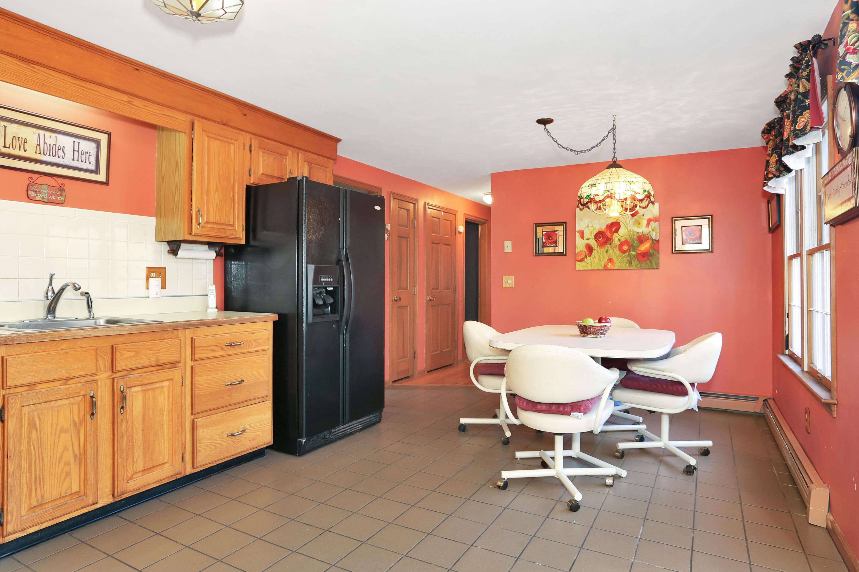 188 Camelback Road Marstons Mills, MA 02648 - Photo 5 of 22 a dining room filled chandelier and wooden furniture