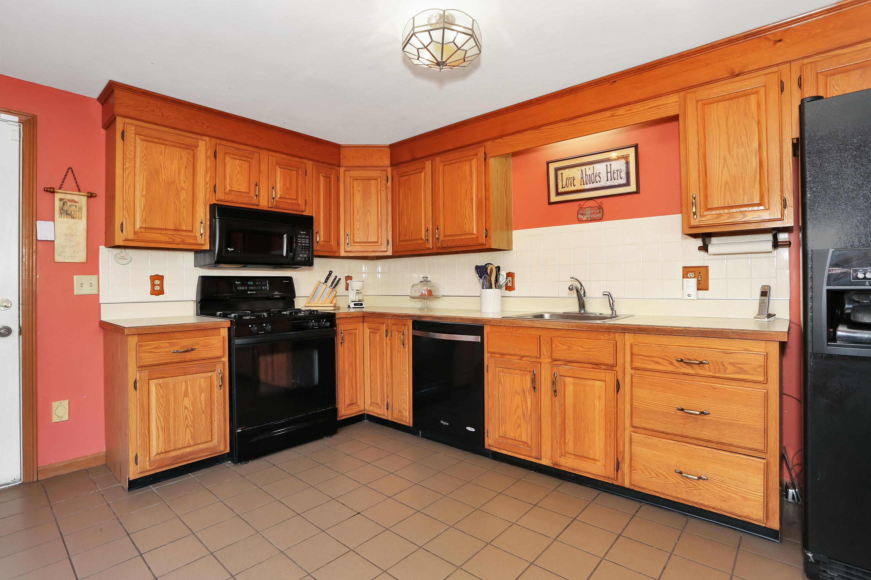 188 Camelback Road Marstons Mills, MA 02648 - Photo 6 of 22 a kitchen with stainless steel appliances granite countertop a stove top oven a sink dishwasher and granite countertops with wooden floor