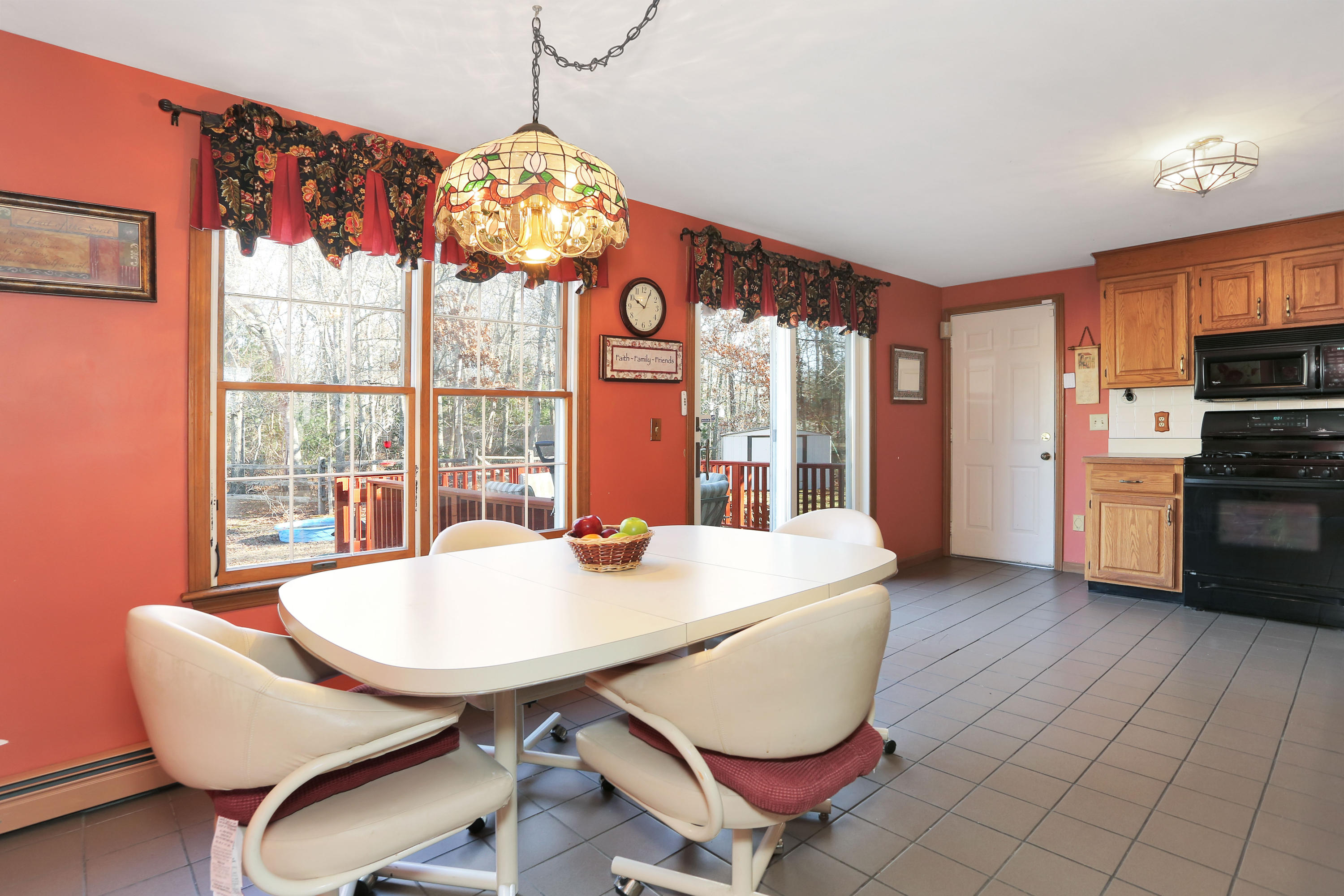 188 Camelback Road Marstons Mills, MA 02648 - Photo 7 of 22 a view of a dining room with furniture a chandelier and wooden floor