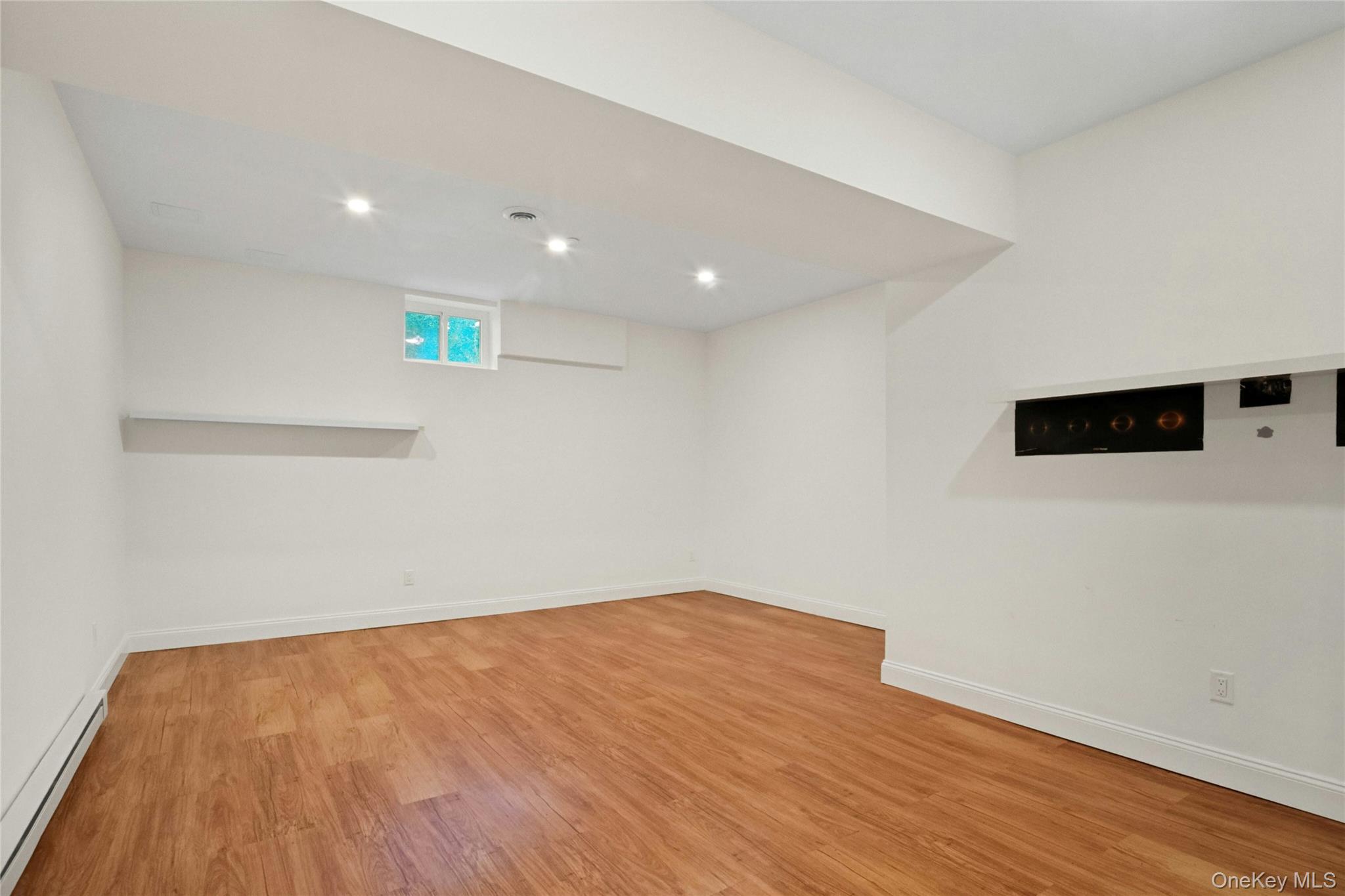 25 Riverview Road Irvington, NY 10533 - Photo 33 of 41 High ceiling, Rec Room and a bonus room with door to the side yard.
