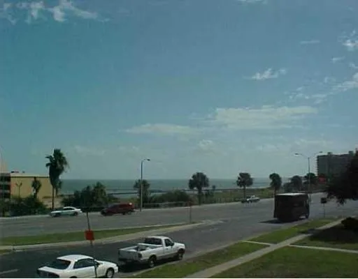 a view of a golf course with chairs