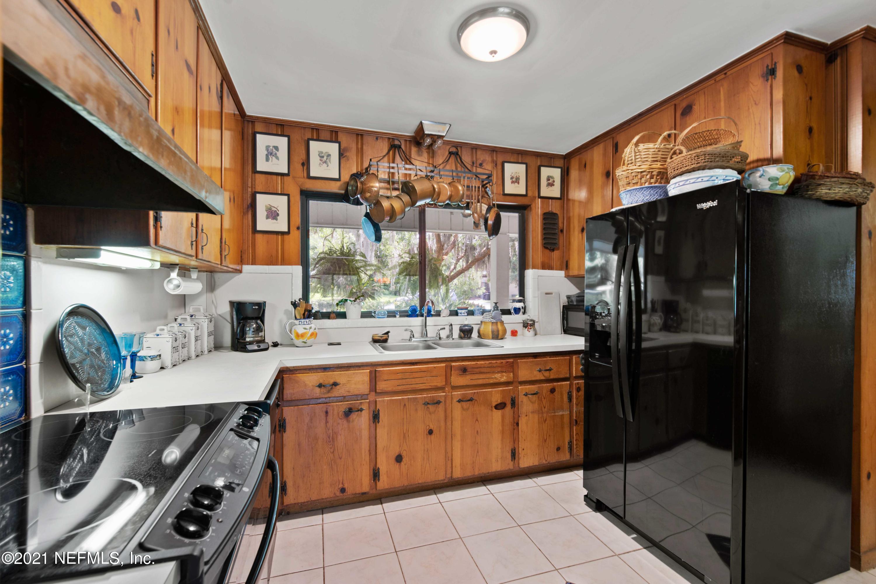 6514 Colgate Road Jacksonville, FL 32217 - Photo 11 of 31 a kitchen with a sink a stove and a refrigerator